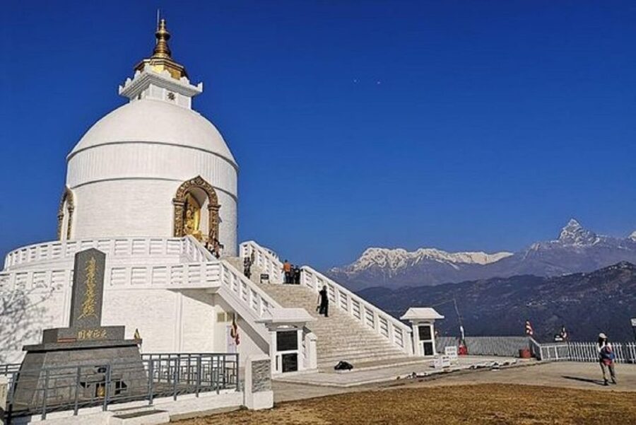 From Pokhara: Guided Day Jungle Hiking Tour with Boat Ride - Shiva statue and the way the route loops back to town