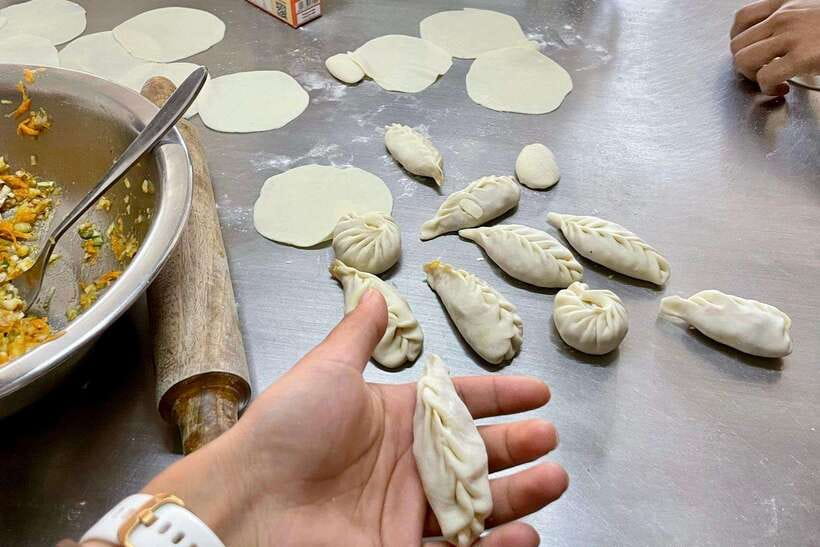 Kathmandu: Traditional Momo Making Class & Pickup - The market stop: picking ingredients for veggie, vegan, or chicken fillings